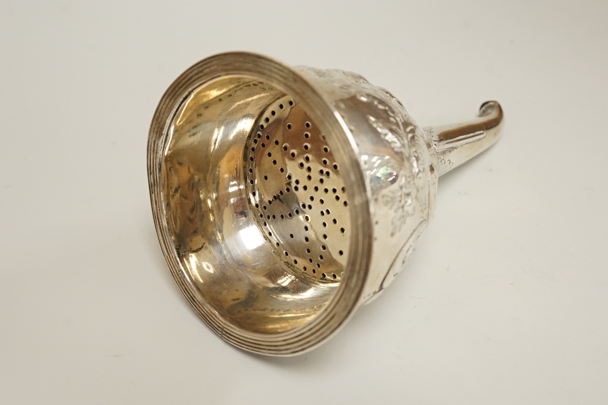 A George III silver wine funnel, with later embossed decoration and later engraved inscription, Crispin Fuller, London 1802, 13.4cm (a.f.).